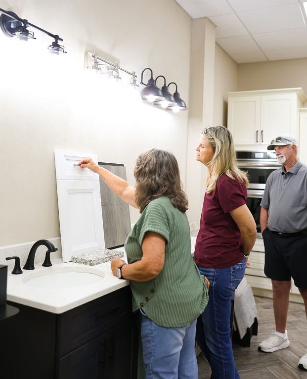 People picking out drawer faces